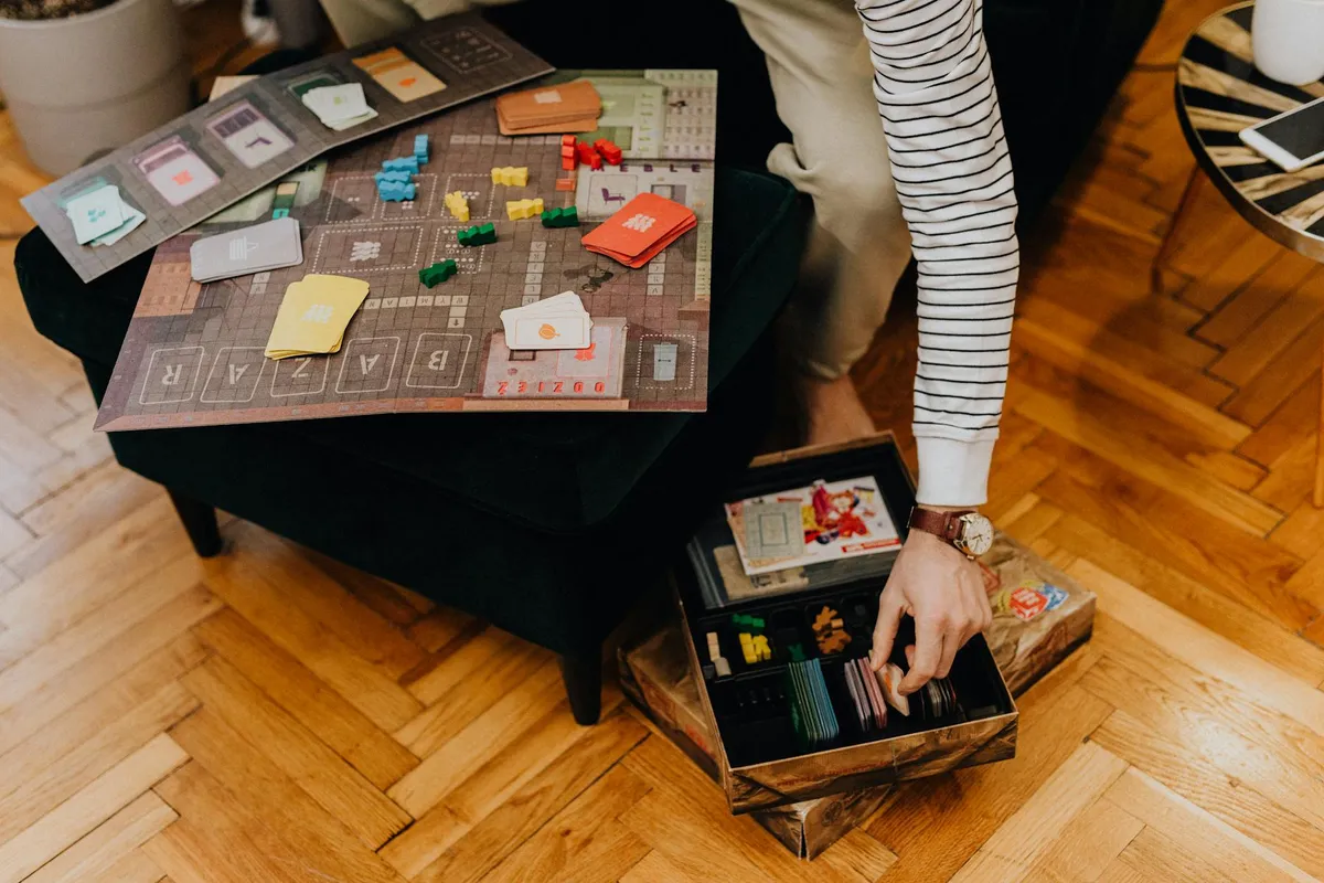 Board game pieces arranged on a wooden table at evening